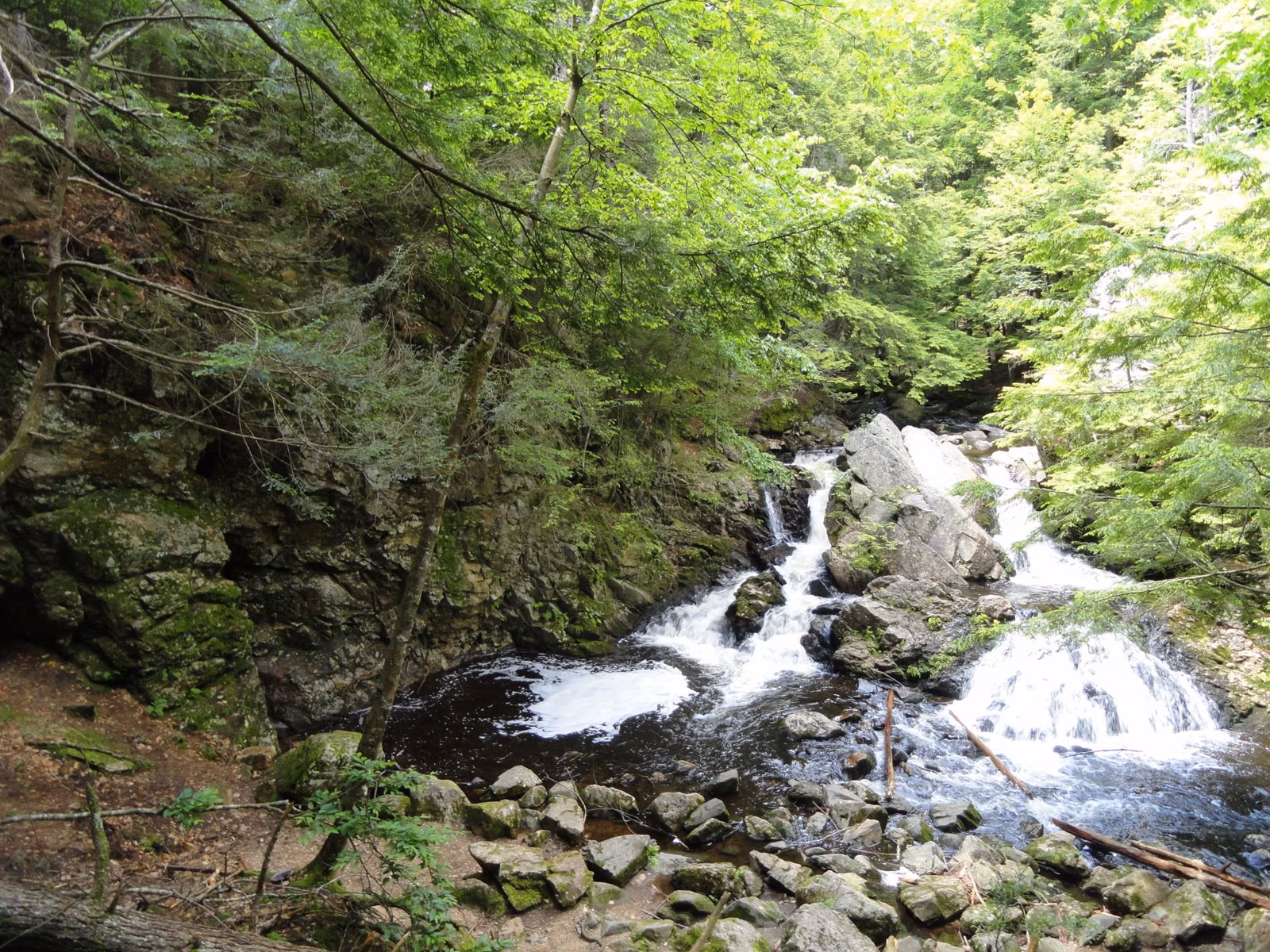 A small waterfall over rocks in the woods of New Salem, Massachusetts