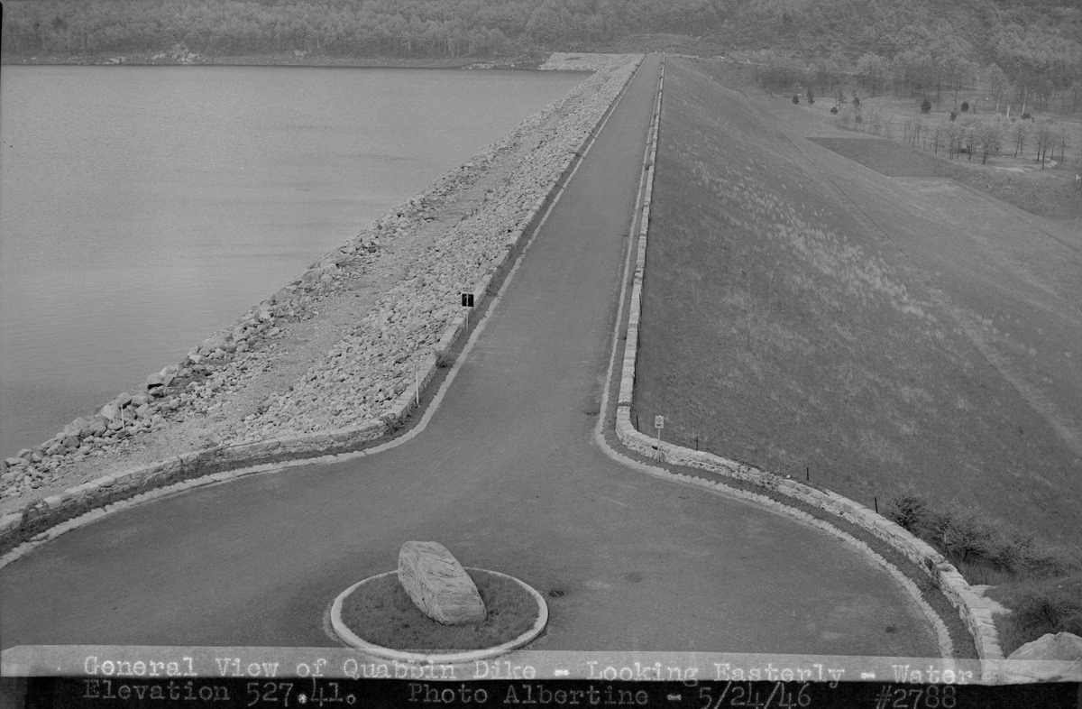 Black-and-white 1946 view along the grassy slope of Goodnough Dike with the full reservoir beside it