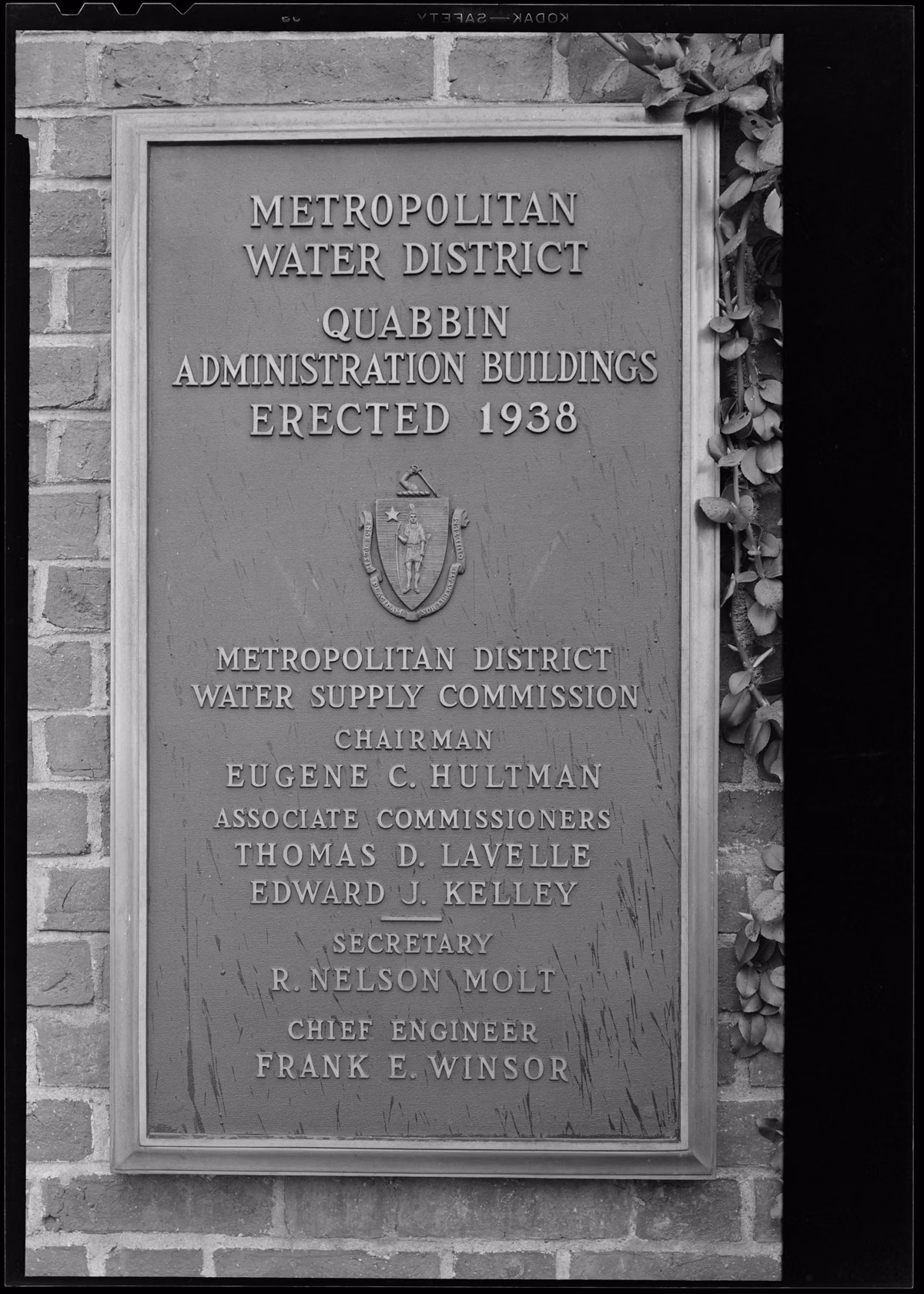 Black-and-white 1948 photo of a bronze tablet at the Quabbin Administration Building