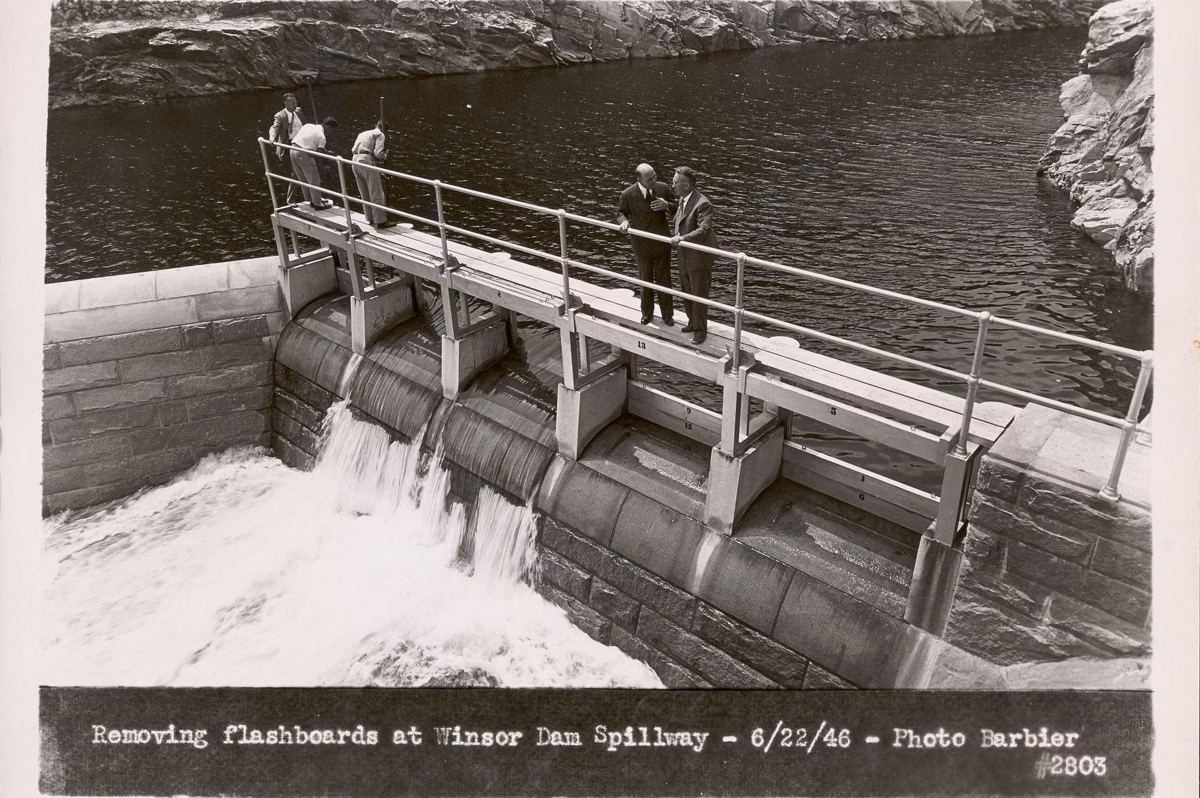 Black-and-white photo of workers at the Winsor Dam spillway on June 22, 1946, the day the reservoir was full
